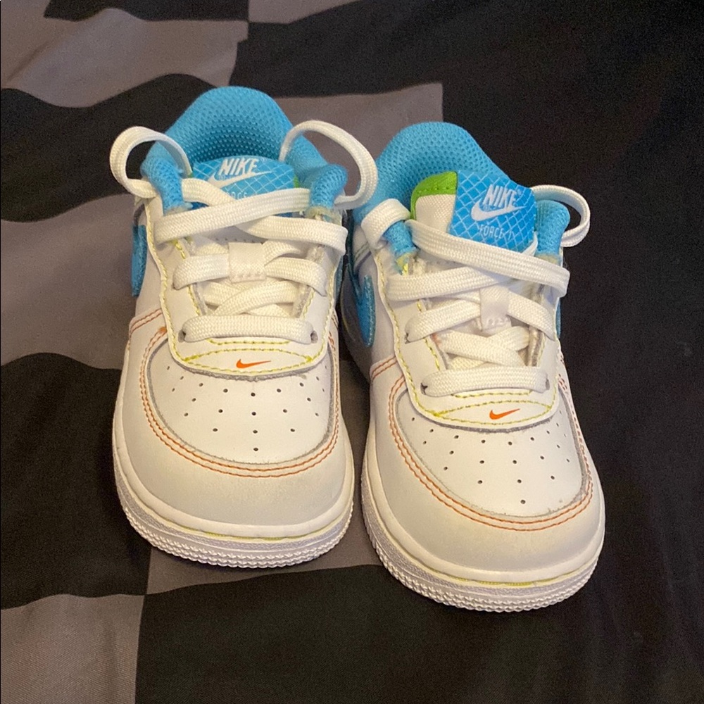 Nike White and Blue Sneakers with Classic Design